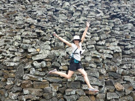 Premium Photo Cheerful Woman Jumping Against Wall Of Tears