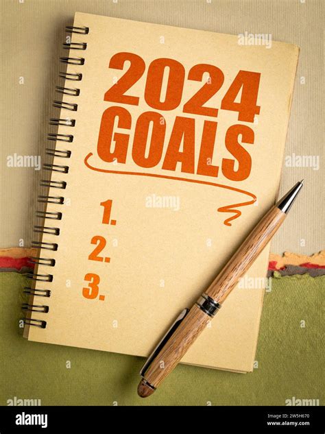 2024 Goals List In A Notebook With Pen Setting New Year Goals And