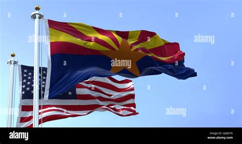 The Flags Of The Arizona State And United States Waving In The Wind