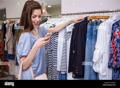 Brunette Shopping And Sending Text Stock Photo Alamy