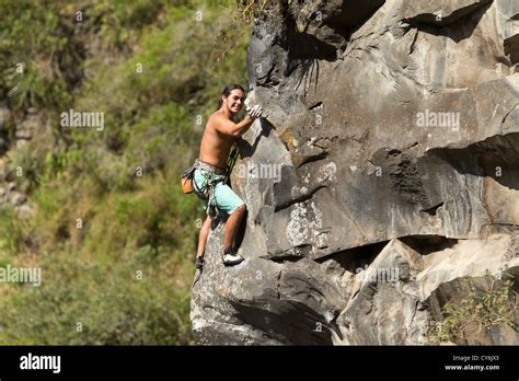 Rock Climber Climb Up A Cliff Stock Photo - Alamy