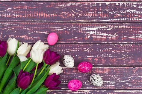 Premium Photo Easter Eggs And Tulips On Wooden Planks