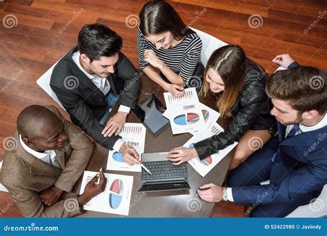 Group Of Multiethnic Busy People Working In An Office Stock Photo