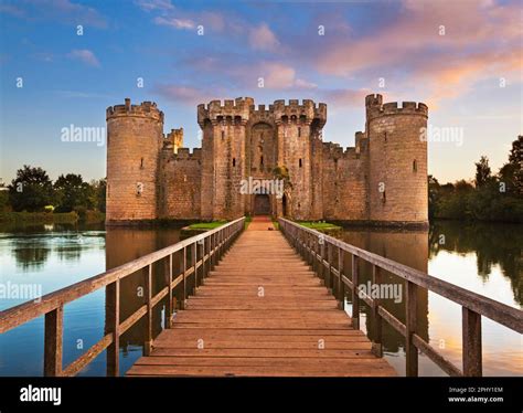 Bodiam Castle with drawbridge and moat at sunset - Bodiam Castle 14th ...