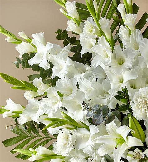 White Rose And Lily Sympathy Standing Spray Arranged By A Florist In