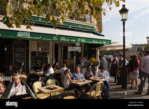 A restaurant on the Ile St Louis, Paris, with a queue to the right for ...