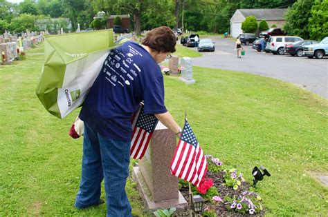 PHOTOS: TJX Employees & Volunteers Place Flags at Graves of Veterans at