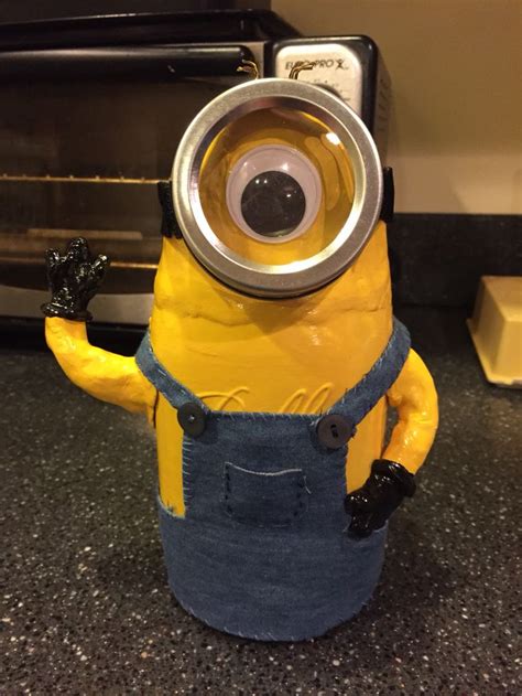 A Minion Is Standing In Front Of An Oven