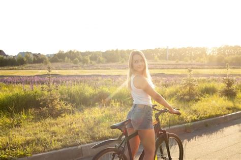 Blonde Girl Riding A Bike Photo Free Download