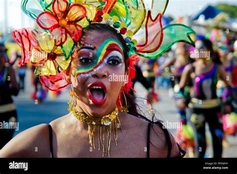 A Colombian Girl Wearing A Colorful Costume And Make Up Dances During