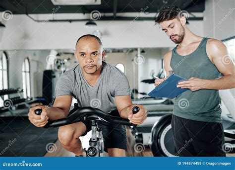 Mature Man Riding On Stationary Bicycle Stock Photo Image Of Muscle