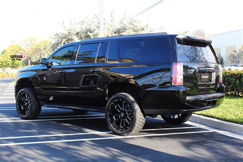 2016 GMC YUKON XL WITH 4 FTS LIFT KIT 22 HOSTILE WHEELS 33 NITTO