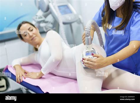 Woman In Special White Suit Having A Anti Cellulite Massage With Spa