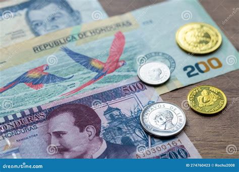 Currency Of Honduras A Rolled Up Lempira Banknote With Macaw