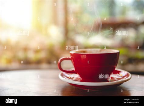Hot Drinks In Coffee Cup On Wood Table In Cafe With Space For Text Stock Photo Alamy