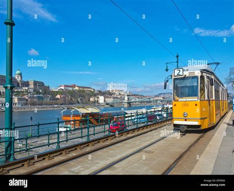 Yellow Tram Electric Tramway Near Danube River In Budapest Hungary