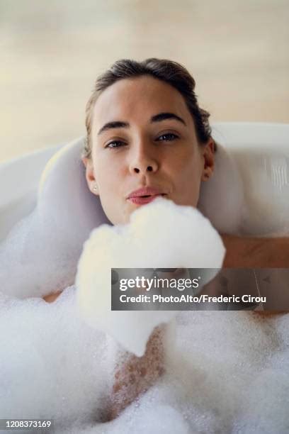 Woman Blowing Soap Bubbles Photos And Premium High Res Pictures Getty