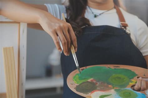 Premium Photo Cropped Image Of Female Artist Standing In Front Of An