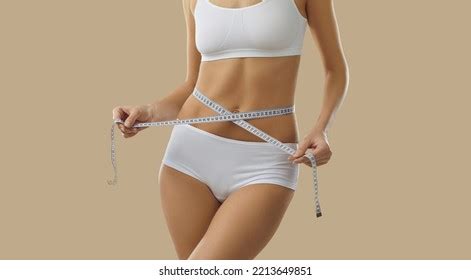 Slender Woman Lingerie Measures Figure Tape Stock Photo