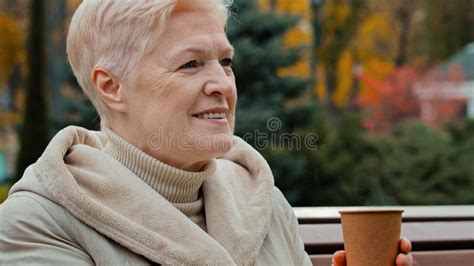 Happy Dreamful Gray Haired Elderly Mature Woman Grandmother Sitting On