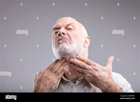 Mature Man Checking His Beard And Neck Stock Photo Alamy