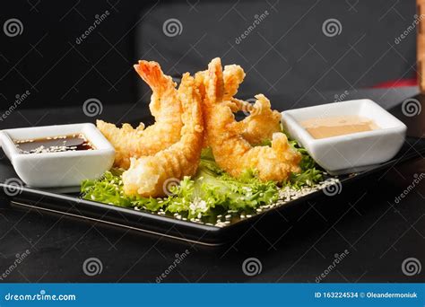 Tempura Deep Fried Shrimp Ebi With Sweet Chili And Soy Sauce On Black