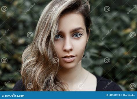 Portrait Of A European Attractive Young Woman With A Sweet Smile With