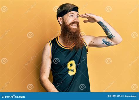 Redhead Man With Long Beard Wearing Basketball Uniform Very Happy And