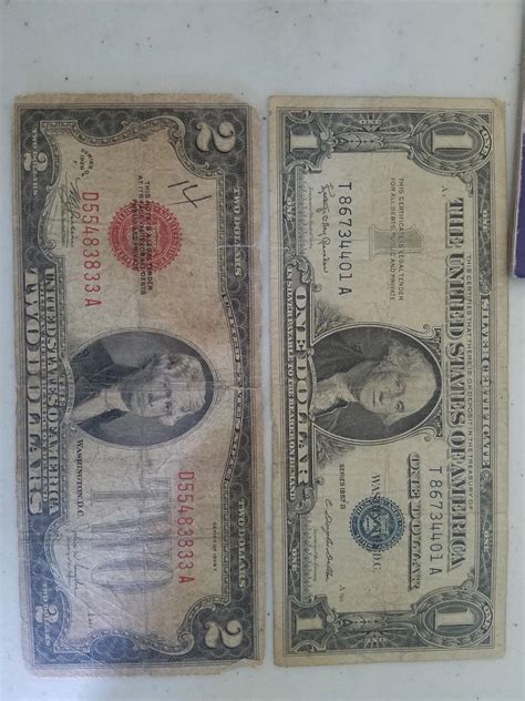 Silver Certificate 1 Dollar bill series 1957 B and a Red Seal 2 Dollar