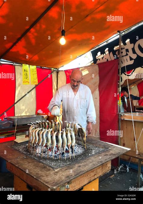 Grilled Fish Vendor At Ueno Onshi Park Stock Photo Alamy