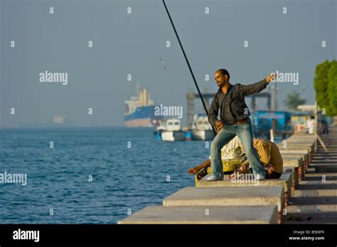 Man Fishing in the Suez Canal in Suez Egypt Stock Photo: 20597677 - Alamy