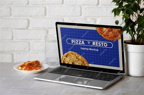 Premium PSD | Laptop and food on table