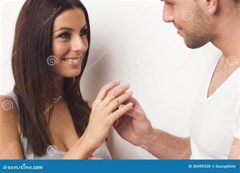 Young Couple Giving Each Other Engagement Ring Stock Photo Image Of