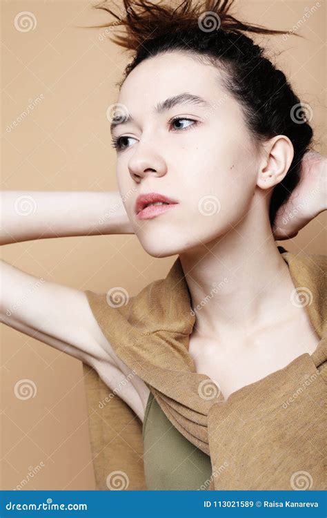 Headshot Portrait Of Girl Wearing Casual Clothes Beige Background