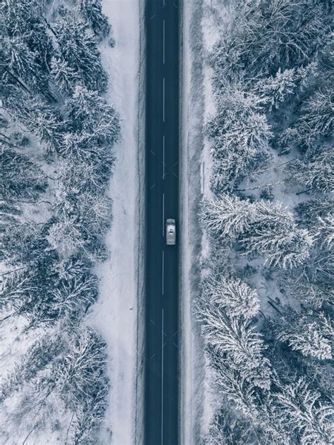 Aerial View of a Scenic Snow-Covered Country Road