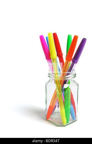 Coloured Ballpoint Pens In A Glass Against A Grey Background Stock