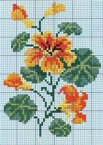 A Cross Stitch Pattern With Yellow And Orange Flowers