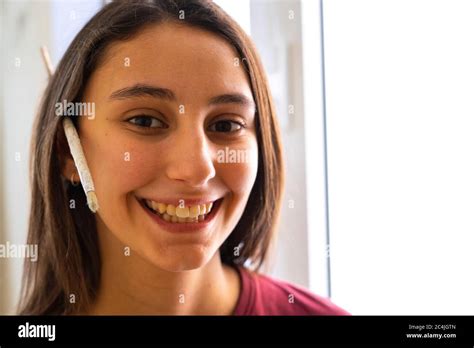 Female Painter With Brush On Ear Concept Of Painter And Painting The