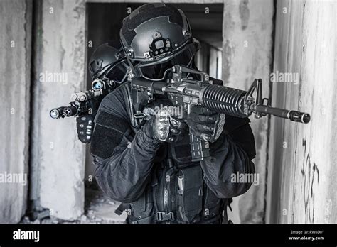 Squad of SWAT police special forces in action Stock Photo - Alamy