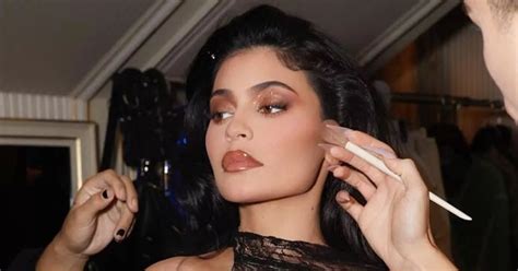 Kylie Jenner Wears Tiny Black Bikini As She Cuddles Up To Son For Rare