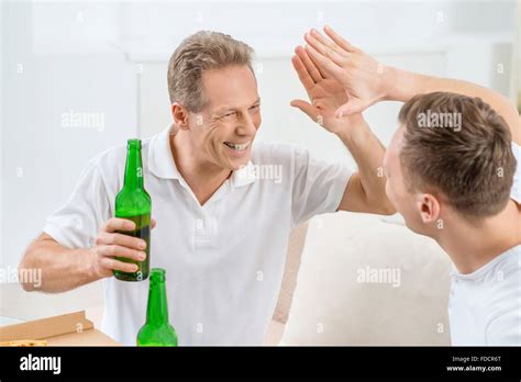 Father And Adult Son Drinking Beer Stock Photo Alamy