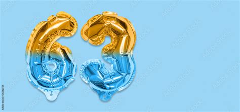 Rainbow Foil Balloon Number Digit Sixty Three On A Blue Background