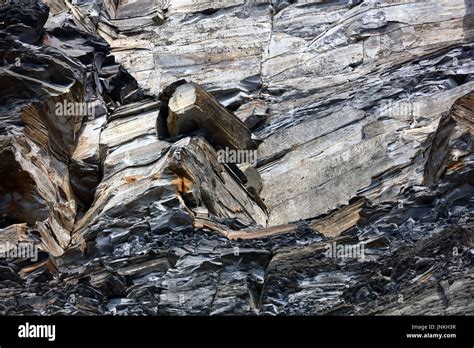 Geological Cliff Structures With Limestone And Soft Crumbling Oil