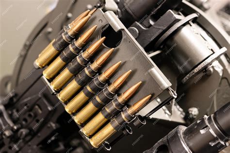 Premium Photo Close Up Of Of Bullets In A Coaxial Machine Gun Belt