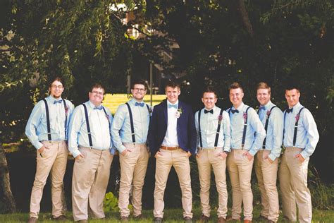 Light Blue Shirt Khaki Pants Navy Suspenders Groom With Blazer Groomsmen Pose Blue