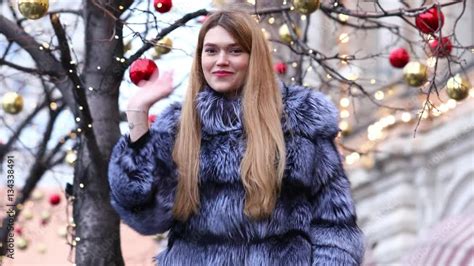 Young Blonde Woman In Blue Fur Coat Outdoor In Winter Stock Video