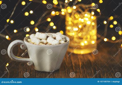 Hot Chocolate With Marshmallows Against Background With Beautiful Lights Of Bokeh Stock Photo