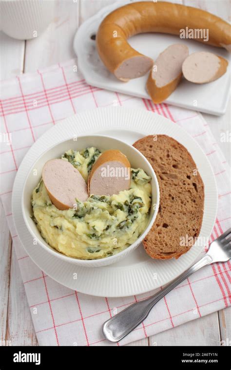 Traditional Dutch dish Stamppot with Rookworst sausage Stock Photo - Alamy