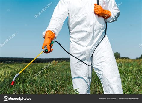 Cropped View Exterminator Latex Gloves White Uniform Holding Spray