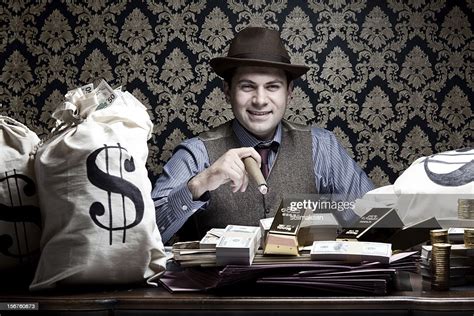 Rich Man Posing With Money Bags Gold And Dollar Bills High Res Stock